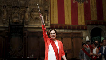 Ada Colau gestures during her swearing-in ceremony as the new mayor of Barcelona, at Barcelona's town hall, Spain (Reuters/Albert Gea)