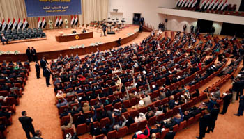 Members of the Iraqi parliament gather to vote at the parliament headquarters in Baghdad (Reuters/Thaier Al)
