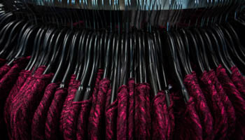 Sweaters are seen on a rack at H&M (Reuters/Eric Thayer)