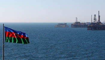 An Azerbaijan state flag flutters in the wind on an oil platform in the Caspian Sea east of Baku (Reuters/David Mdzinarishvili)