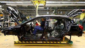 A Mercedes Benz employee at the factory, Germany (Reuters/Kai Pfaffenbach)