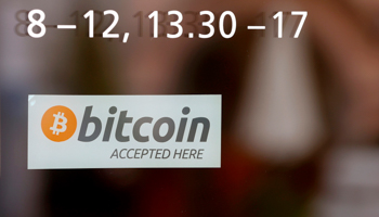 A "Bitcoin accepted here" sticker (Reuters/Arnd Wiegmann)
