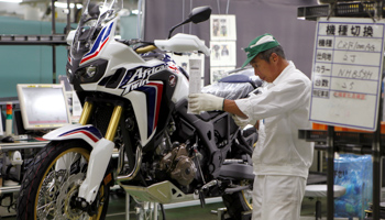 A worker on an assembly line at Honda's factory in Kumamoto (Reuters/Naomi Tajitsu)