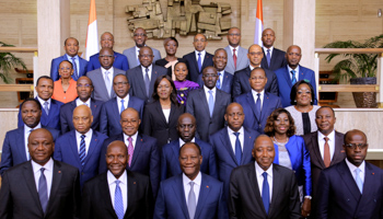 President Alassane Ouattara with his newly formed government in Abidjan (Reuters/Thierry Gouegnon)