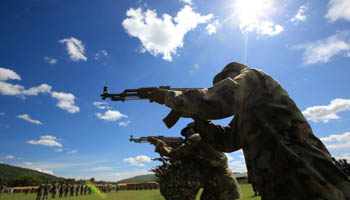 Members of the Uganda army take their positions during their training in combat operation skills (Reuters/James Akena)