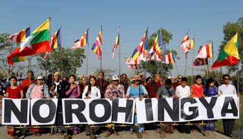 People protest as a Malaysian NGO's aid ship carrying food and emergency supplies for Rohingya Muslims arrives at the port in Yangon, Myanmar (Reuters/Soe Zeya Tun)