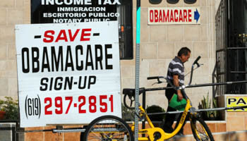 An insurance store advertises Obamacare in San Ysidro, California (Reuters/Mike Blake)