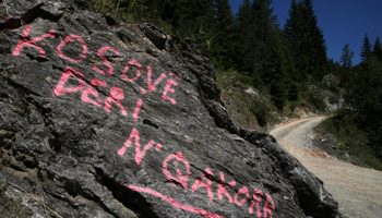 "Kosovo as far as Qakorr" is spray-painted on rocks at a crossroads in Peja in Kosovo, near the border with Montenegro (Reuters/Hazir Reka)