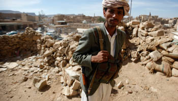 A tribesman stands guard as he secures an area during a visit by United Nations envoy to Yemen Jamal bin Omar, at the northwestern Yemeni city of Saada (Reuters/Khaled Abdullah)