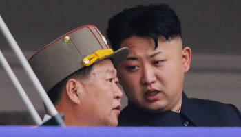 North Korean leader Kim Jong-un speaks to Choe Ryong-hae (L), director of the General Political Bureau of the Korean People's Army (Reuters/Jason Lee)