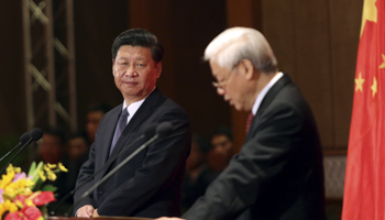 Chinese President Xi Jinping, left, with the Vietnamese Communist Party General Secretary Nguyen Phu Trong in Hanoi (Reuters/Na Son Nguyen/Pool)