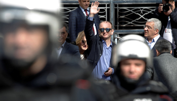 Opposition leaders Milan Knezevic, left, and Andrija Mandic behind a police cordon outside parliament in February (Reuters/Stevo Vasiljevic)