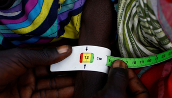 A child is checked for signs of malnutrition by a UNICEF health worker during a registration prior to a humanitarian food distribution (Reuters/Siegfried Modola)