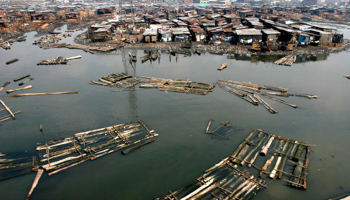 Logs of wood float in the Lagos lagoon near the Makoko Riverine slum (Reuters/Akintunde Akinleye)