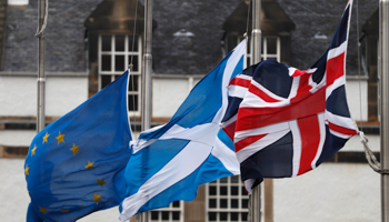 The Union flag, Scotland's Saltire and the European Union flag flying from Scotland's Parliament building at Holyrood in Edinburgh (Reuters/Russell Cheyne)