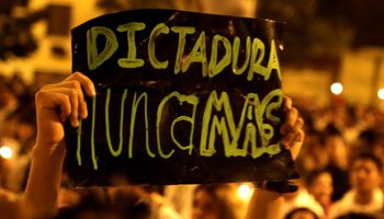 A sign reading ‘Dictatorship Never Again’ at an April 3 protest (Reuters/Jorge Adorno)