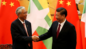 Chinese President Xi Jinping, right, shakes hands with Myanmar's President Htin Kyaw at the Great Hall of People in Beijing (Reuters/Yohei Kanasashi)