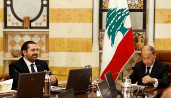 Lebanon's President Michel Aoun and Prime Minister Saad al-Hariri (L) attend the first meeting of the new cabinet at the presidential palace in Baabda, Lebanon (Reuters/Mohamed Azakir)