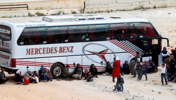 People, evacuated from the rebel-besieged Shi'ite villages of al-Foua and Kefraya, travel to government-controlled Aleppo (Reuters/Ammar Abdullah)