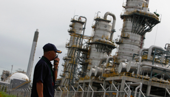 A security guard at Thai PTT's gas plant (Reuters/Sukree Sukplang)