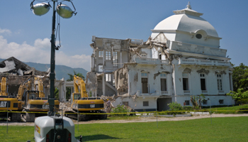 Construction machinery around the collapsed cupola of the condemned National Palace in 2012, Port-au-Prince (Reuters/Swoan Parker)