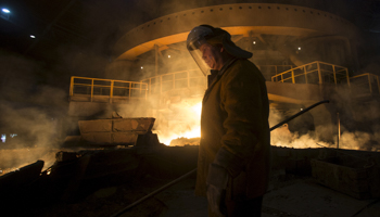 A keeper works at a cast house at the Novolipetsk steel mill in Lipetsk, Russia (Reuters/Maxim Shemetov)