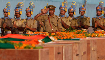 Central Reserve Police Force personnel pay their respects to policemen killed in the April 24 Maoist attack (Reuters/Adnan Abidi)