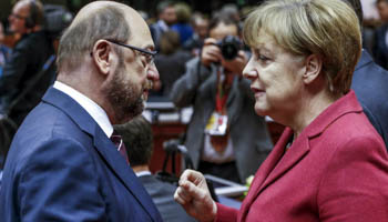 European Parliament President Martin Schulz (L) and German Chancellor Angela Merkel attend a European Union leaders summit in Brussels (Reuters/Yves Herman)