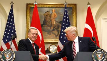 Turkish President Recep Tayyip Erdogan, left, shakes hands with US President Donald Trump in the White House Roosevelt Room, Washington (Reuters/Kevin Lamarque)