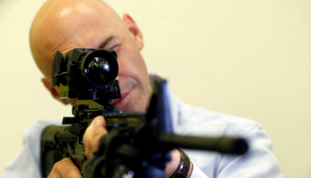 An employee gives a weapons demonstration at Israeli defense firm, Elbit Systems, in Netanya (Reuters/Baz Ratner)