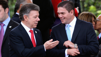 President Juan Manuel Santos, left, with then-Defence Minister Juan Carlos Pinzon during Colombia's Independence Day celebrations in Bogota, 2014 (Reuters/John Vizcaino)