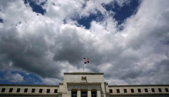 Flags fly over the Federal Reserve Headquarters in Washington, US (Reuters/Kevin Lamarque)