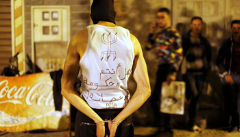 Protester in Morocco with a t-shirt says "Are you a government or a gang" (Reuters/Youssef Boudlal)