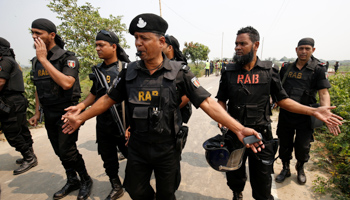 Security personnel block the road where police shot dead a suspected militant in Bangladesh (Reuters/Mohammad Ponir Hossain)