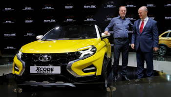 Chief executive of Russia's carmarker Avtovaz, Nicolas Maure (R) and Avtovaz design chief Steve Mattin pose next to Lada Xcode Concept as they take part in the 2016 Moscow International Auto Salon in Moscow (Reuters/Maxim Shemetov)