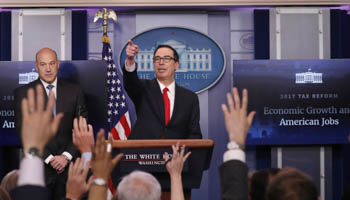 U.S. National Economic Director Gary Cohn (L) and Treasury Secretary Steven Mnuchin unveil the Trump administration's tax reform proposal in the White House briefing room in Washington (Reuters/Carlos Barria)