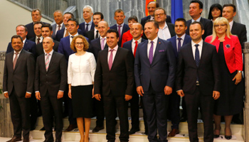 Social Democrat leader Zoran Zaev, centre, poses with newly elected ministers at the Macedonian parliament in Skopje, on June 1 (Reuters/Ognen Teofilovski)