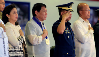 Philippines President Rodrigo Duterte, centre, attends the 70th Philippine Air Force anniversary at the Clark Air Base in Angeles city north of Manila, on July 4 (Reuters/Romeo Ranoco)