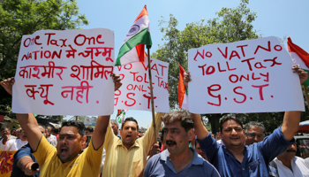 Traders protest to demand implementation of the Goods and Services Tax in Jammu and Kashmir state, in Jammu (Reuters/Mukesh Gupta)