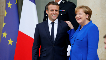 French President Emmanuel Macron, left, with German Chancellor Angela Merkel (Reuters/Gonzalo Fuentes)