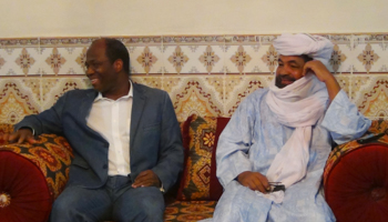 Iyad Ag Ghali, right, the leader of Ansar Dine, an al Qaeda-linked Islamist group in northern Mali, meets with Burkina Faso foreign minister Djibril Bassole in Kidal, northern Mali in 2012 (Reuters/Stringer)