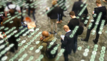 People waiting in a crowd and using their phones (istockphoto)