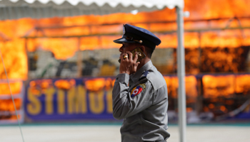 A police officer at an event to mark International Day against Drug Abuse and Illicit Trafficking, outside Yangon, Myanmar (Reuters/Soe Zeya Tun)