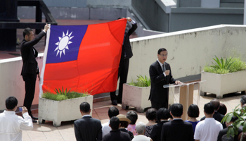 An official of Taiwan's embassy addresses people at the embassy in Panama City, Panama (Reuters/Carlos Lemos)