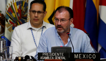 Mexico's Foreign Minister Luis Videgaray, right, speaks during the Organization of American States 47th General Assembly in Cancun, Mexico (Reuters/Carlos Jasso)
