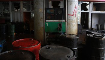 Barrels of fuel inside a damaged non-functioning petrol station in Aleppo (Reuters/Nour Kelze)