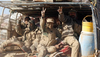 Members of the Shi'ite Badr Organisation fighters ride in a military vehicle during a battle with Islamic State militants at the airport of Tal Afar west of Mosul, Iraq (Reuters/Khalid al Mousily)