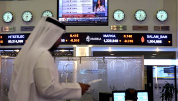Traders monitor stock information at Dubai Financial Market, in Dubai, United Arab Emirates, June 5, 2017. (Reuters/Stringer)