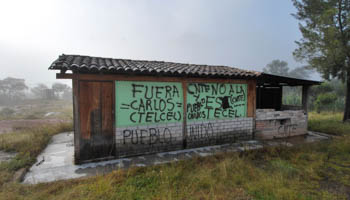 Grafitti saying “Carlos [Slim] Telcel out” (Reuters/Christine Murray)