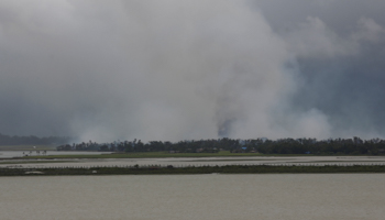 Smoke is seen on the Myanmar side of the border from Teknaf, Bangladesh, in August 2017 (Reuters/Mohammad Ponir Hossain)